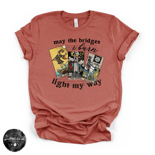 May the bridges I burn light my way graphic tee clay