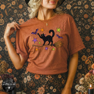 Black Cat on a Broom Tee | Witchy Halloween Cat Graphic T-Shirt