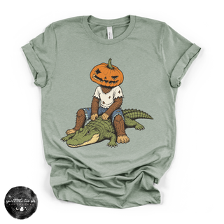 Pumpkin Head Bigfoot on a Crocodile Tee | Funny Cryptid Halloween Graphic T-Shirt